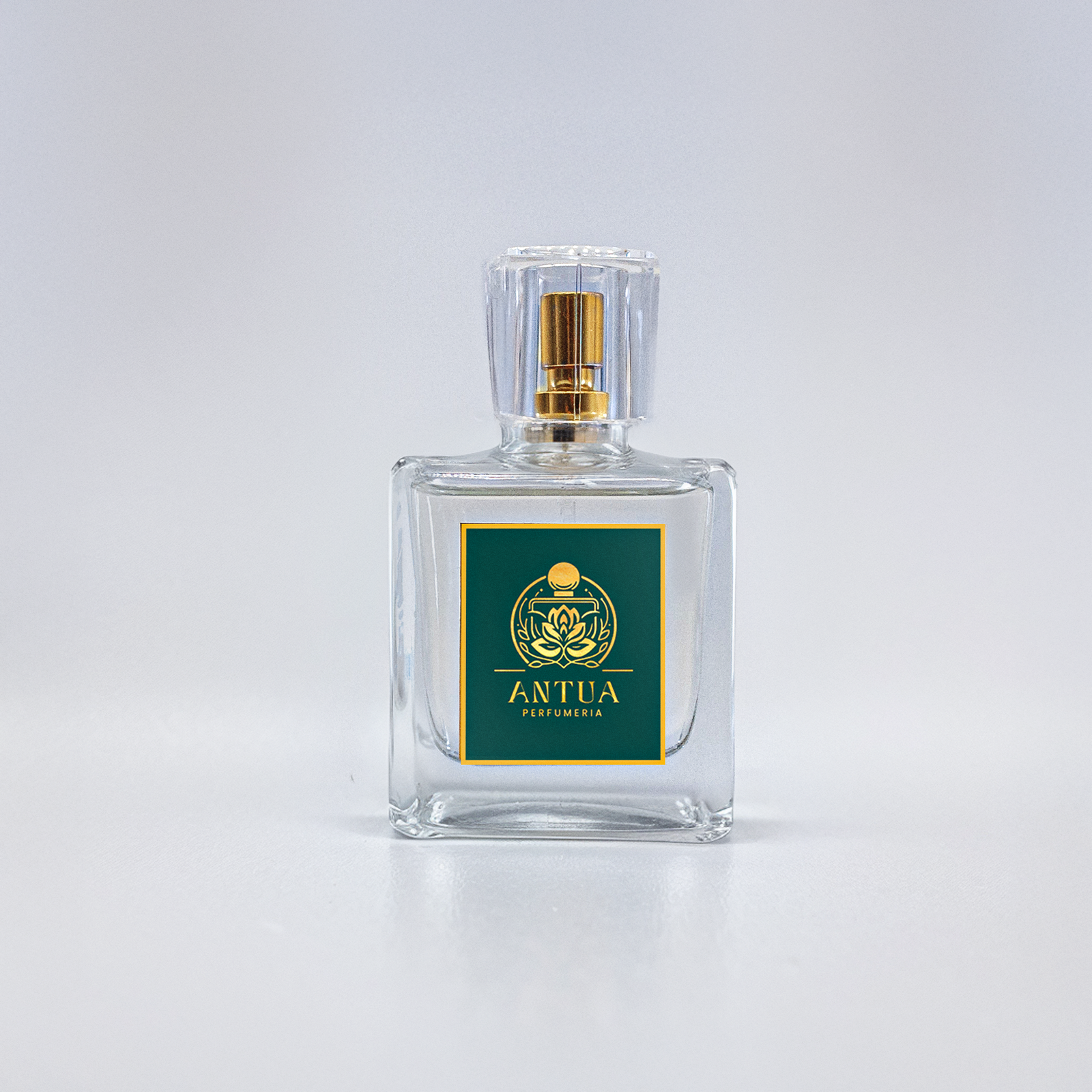 Elegant Antua Perfumeria fragrance bottle with green label and gold floral design.